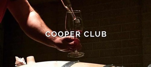 COOPER CLUB - Winemaker filling a glass during a barrel tasting with the words